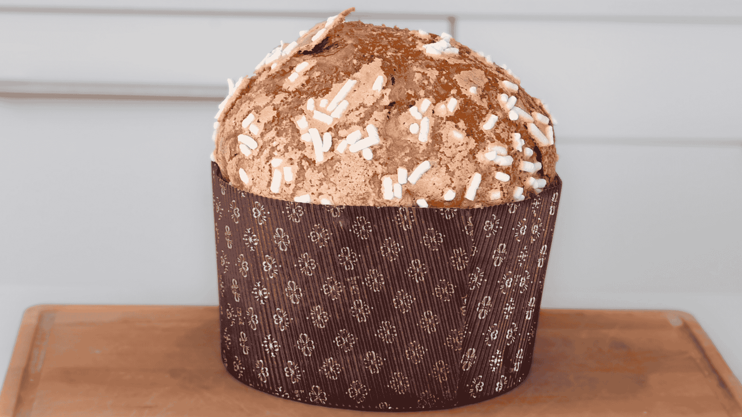 A tall, modern, open-crumb panettone
