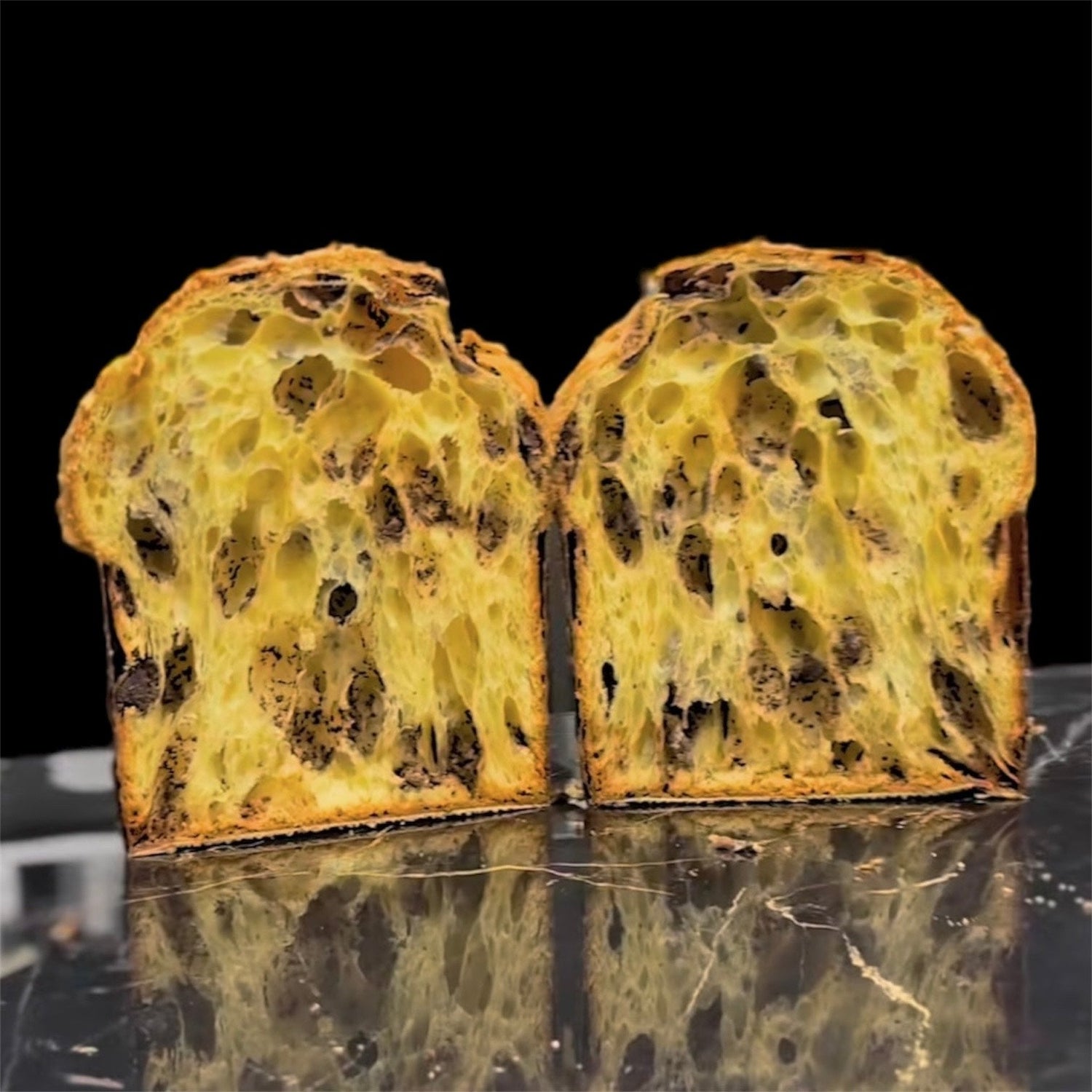 Modern Panettone sliced open showing wild open crumb