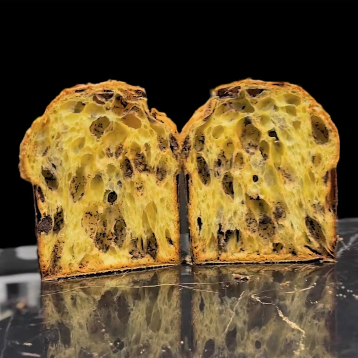 Modern Panettone sliced open showing wild open crumb