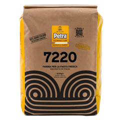 Bag of Petra pasta flour with brand logo and product details on a white background